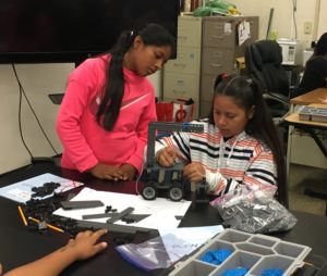 Two middle school students work on a robotics project in the 2018 Middle School Summer School Project Lead the Way Engineering Course.