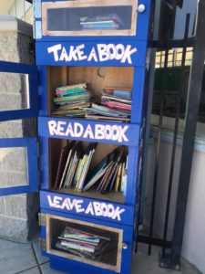 American Union's bight blue Lending Library Box is stationed just outside the main office at the school.