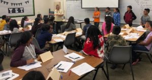 District elementary students being trained in peer mediation by  Fresno State Staff.