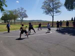 Alt. Ed Basketball team members play in a game against Kings Canyon.