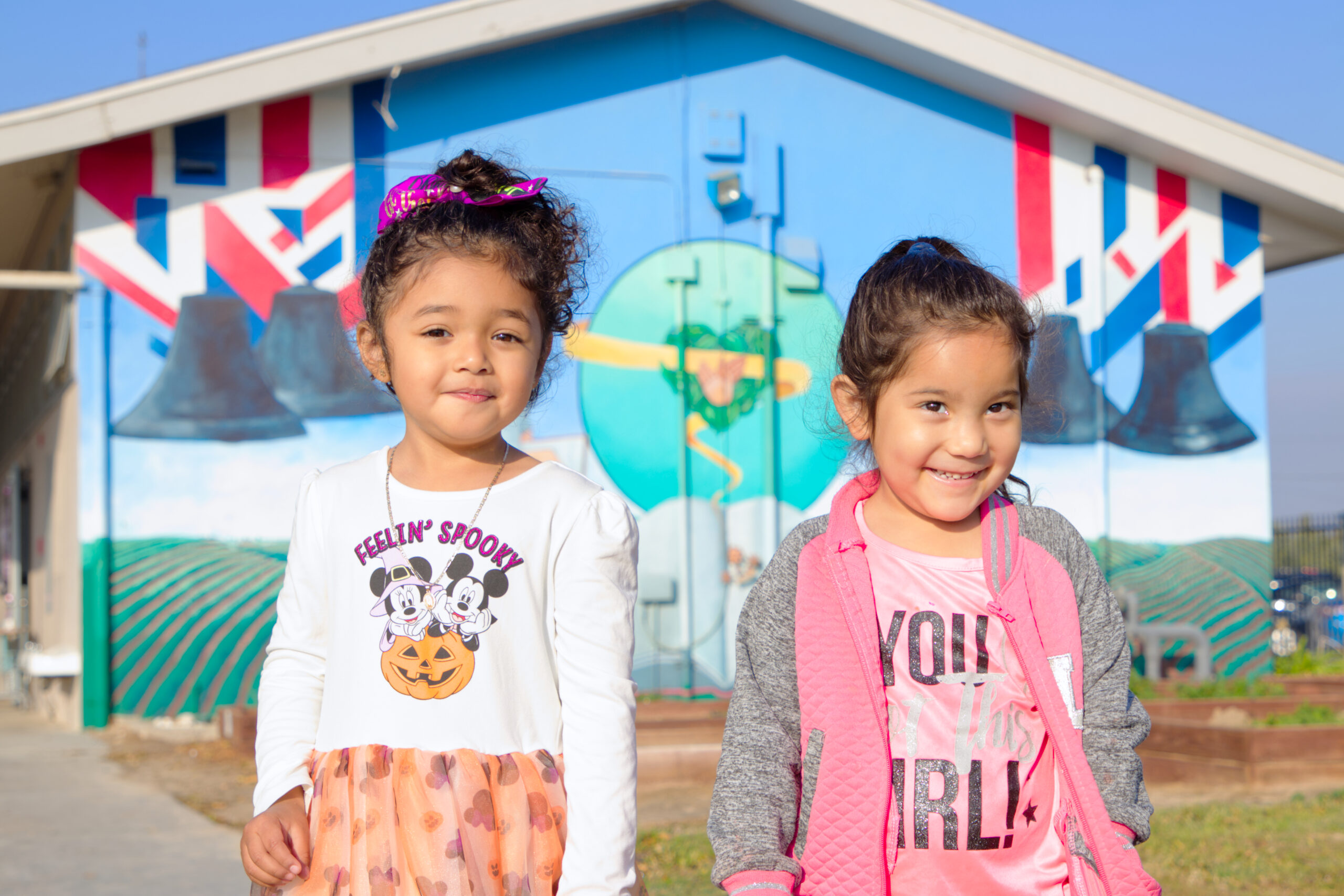 Picture of preschool students smiling in front at American Union School