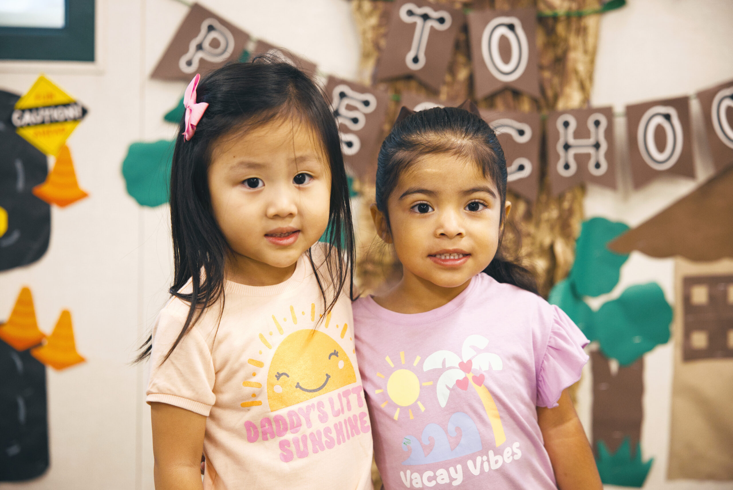 Picture of preschool students smiling in front at American Union School
